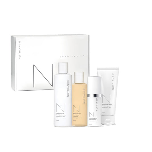 Nutriance skincare product set with bottles and a box on a white background